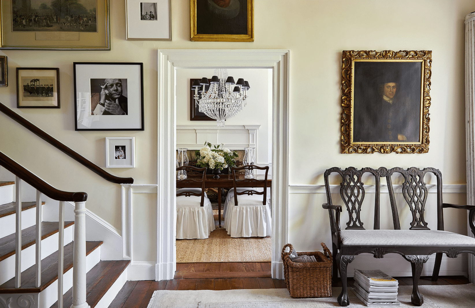 House walkway and stairway looking into a dining room.